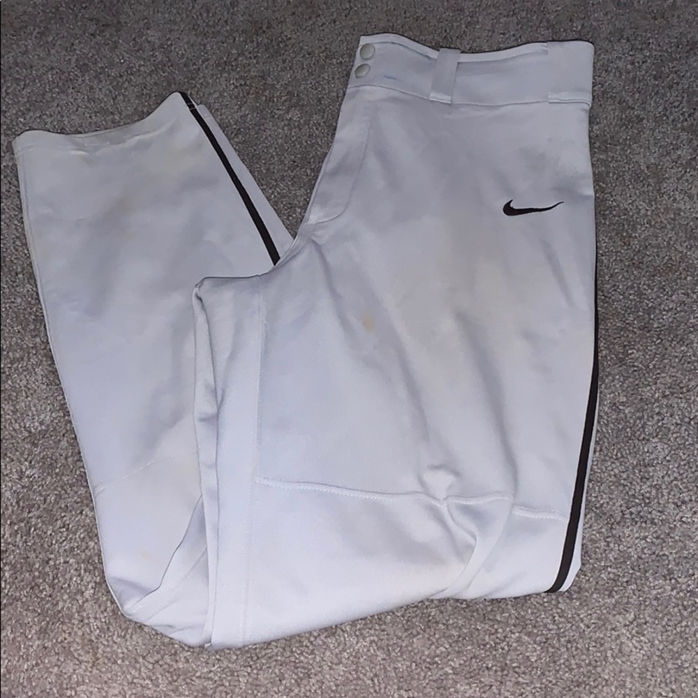 Grey Nike baseball pants.